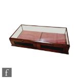 A Victorian mahogany glazed table top display cabinet with twin rear opening doors and recessed