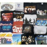 A large collection of Status Quo tour t-shirts, dating from the 1990s to 2000s, all mainly XL