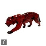 A Royal Doulton Flambe model of a prowling tiger, printed mark, length 34cm.