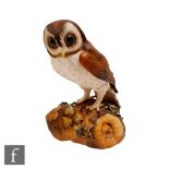 A large Royal Crown Derby model of a brown owl perched on a branch, printed mark alongside XXXVIII