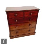 A Victorian mahogany chest of two short and three long drawers, turned wood handles on a plinth base