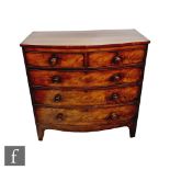 A Victorian mahogany bowfront chest of two short and three long drawers, turned wood handles, on