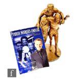 A West Bromwich Albion gilt cold cast statue of the 'Three Degrees' depicting Cyril Regis, Brendan