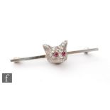 An early 20th Century white gold bar brooch with central diamond encrusted fox head with ruby set