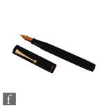 A Dunhill Namiki black lacquered fountain pen, the barrel marked Dunhill Namiki Made in Japan,