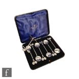 A cased set of six hallmarked silver teaspoons each with two tennis rackets to terminals, Birmingham