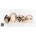 Four assorted 9ct stone set rings to include a cameo and a single stone citrene, total weight 22.5g,