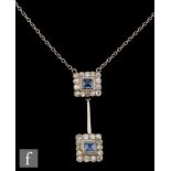 An early 20th Century 18ct white gold sapphire and diamond pendant comprising two square collar