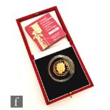 A 22ct fifty pence gold coin to celebrate the One Hundredth Anniversary of the Woman's Social &