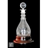 An 18th Century round bottomed decanter of tapering form, circa 1780, with three ringed neck and
