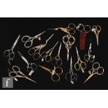 A collection of assorted 19th and 20th Century needlework scissors to include steel and gilt metal