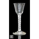An 18th Century wine glass circa 1770, the round funnel bowl above a double series opaque twist stem