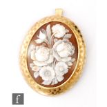 A continental 18ct mounted oval cameo floral spray pendant/brooch, length 5.5cm, weight 15g,