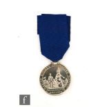 A Marine Society reward for Merit medal, obverse with Britannia holding the hand of a young man,