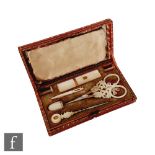 A 19th Century red leather cased Palais Royal etui with eight mother of pearl tools to include