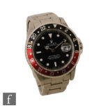 A gentleman's stainless steel wrist watch, Rolex GMT Master II, 16710, 'Coke' bezel, black dial with