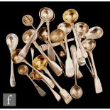 Twenty three assorted Georgian and later salt, mustard and condiment spoons to include fiddle and