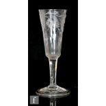 An 18th Century ale glass circa 1740, with round funnel bowl engraved with flowers and leaves