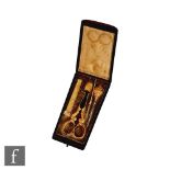 A 19th Century French rosewood cased etui, the flush fitted interior comprising an 18ct gold