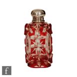 An early 20th Century scent bottle, the ruby flash cut shouldered rectangular bottle below a plain