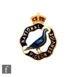 A World War Two National Pigeon Service lapel badge, numbered 15930 to reverse.