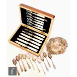 A cased set of six hallmarked silver and mother of pearl fruit knives and forks, Sheffield 1906,
