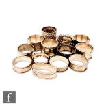 Thirteen hallmarked silver Victorian and later napkin rings to include circular, oval and