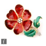 An 18ct enamelled and diamond set brooch modelled as a flower, the diamond set stalk with two