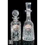 A Waterford glass decanter of mallet form with diamond cut pattern below a faceted cut neck and