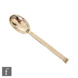 A hallmarked silver spoon with planished decoration and square stepped terminal, length 16.5cm,