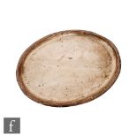 A hallmarked silver oval tray of plan form with raised flower and reed border, length 30cm, weight