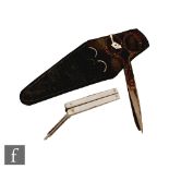 A pair of early 20th Century folding scissors with mother of pearl handles, inset with nail files,