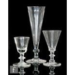 Three assorted drinking glasses, comprising an ale glass circa 1750, the tall conical bowl above a