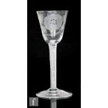 An 18th Century Jacobite drinking glass, circa 1750, the round funnel bowl engraved with a six