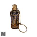 A 19th Century blue glass miniature scent bottle with gilt floral decoration below silver gilt