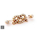 A late 19th Century gold seed pearl set bar brooch modelled as a Staffordshire knot, length 4cm,