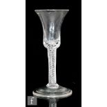 An 18th Century wine glass circa 1745, the waisted bell bowl with multi series air twist stem, the