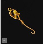 An early 20th Century 14ct gold chatalaine button hook with a flower head to the top set with a