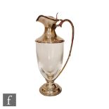 A modern hallmarked silver and clear glass claret jug, circular stepped foot below clear glass body,