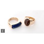 Two gentleman's stone set rings, an elongated lapis lazuli and an oval polished agate example, total