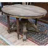 A very large and unusual carved oak Dining Table, with elaborate and profusely carved centre pod,
