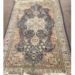 A very good small fawn ground Carpet, with large central medallion,