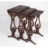 An Oriental lacquered Nest of three Tables, with gilt painted decoration and with dragon head feet.