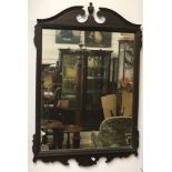 A large pair of Georgian style upright mahogany Mirrors, with swan neck pediment and shaped base,