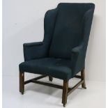 A large 19th Century wing back Armchair, in the early Georgian style,