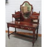 A large early 19th Century walnut Dressing Table, with shield shaped swing mirror,