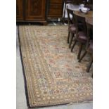 A large attractive Middle Eastern geometric design cream and rust coloured Carpet, 140" x 127".