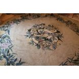 An unusual large Irish woolen green ground circular Carpet,
