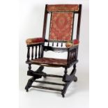 An Edwardian stained oak Rocking Chair, in the manner of Bruce James Talbert,