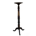 A large early Victorian carved mahogany Torchere or Plant Stand, with dished top,on tripod base,